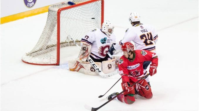 (HC Brodie Dupont) Cole Sandford scored from his knees to give the Cardiff Devils a 2-0 lead over the Guildford Flames in the Elite League Playoff Semi-Finals (Image: James Assinder)